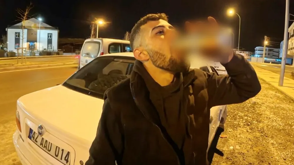 Araç başında alkolle poz verdi: Ehliyetini kaptırdı